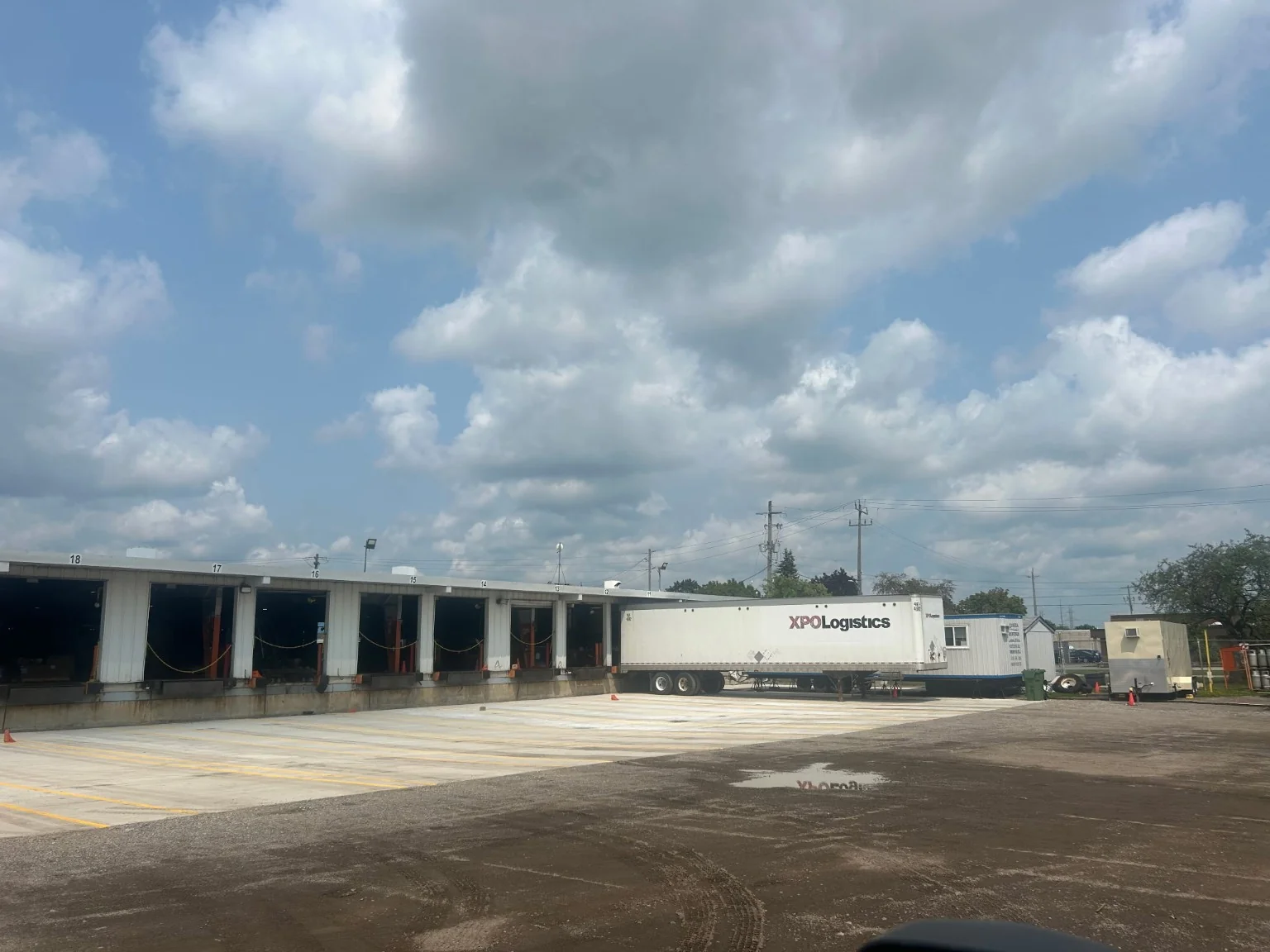 Heavy-duty finished concrete loading dock apron beside an industrial loading facility